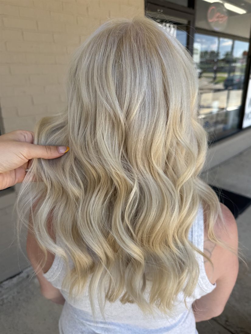 Soft blonde curls with bright dimension