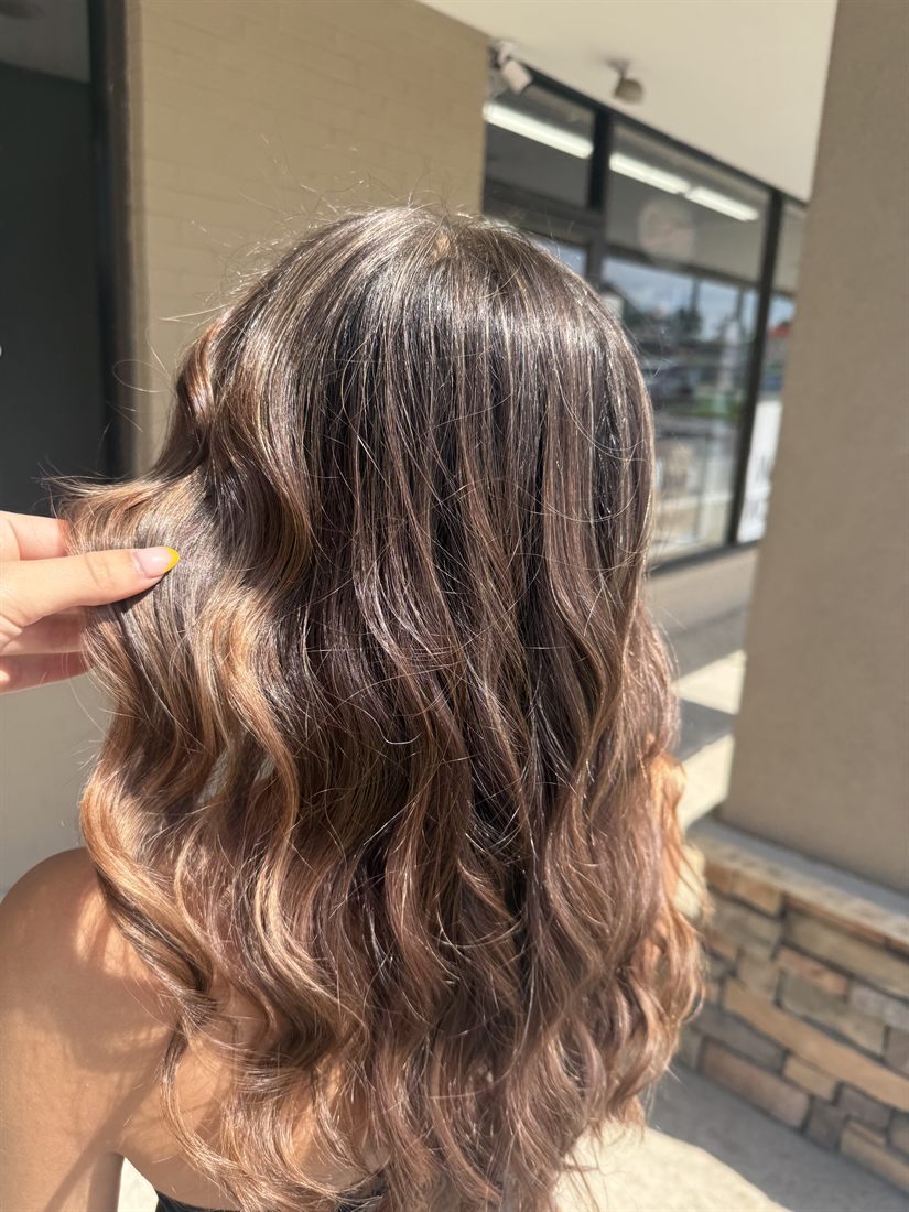 Rich brunette balayage with loose waves