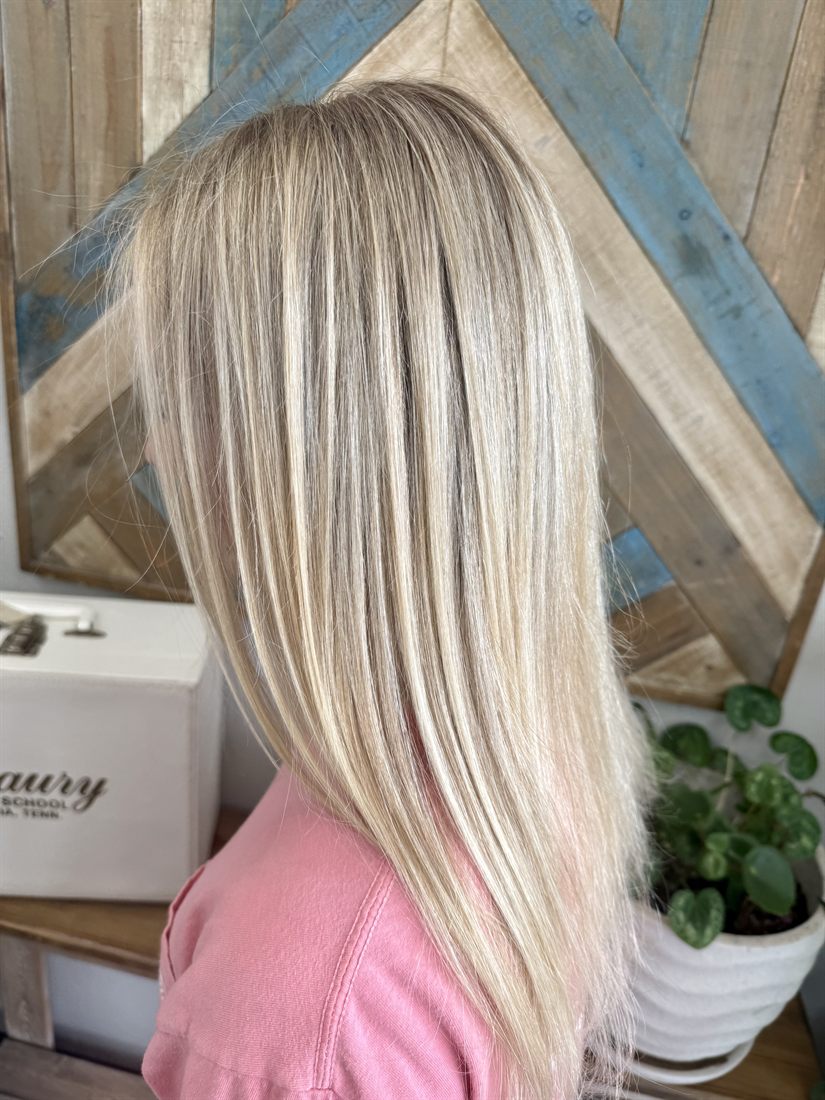 Sleek blonde highlights, straight and glossy