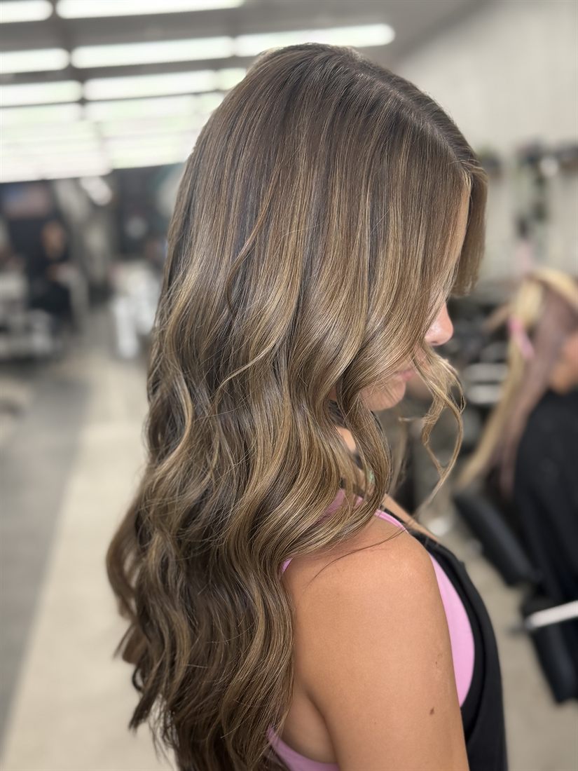 Soft brunette balayage with face-framing waves